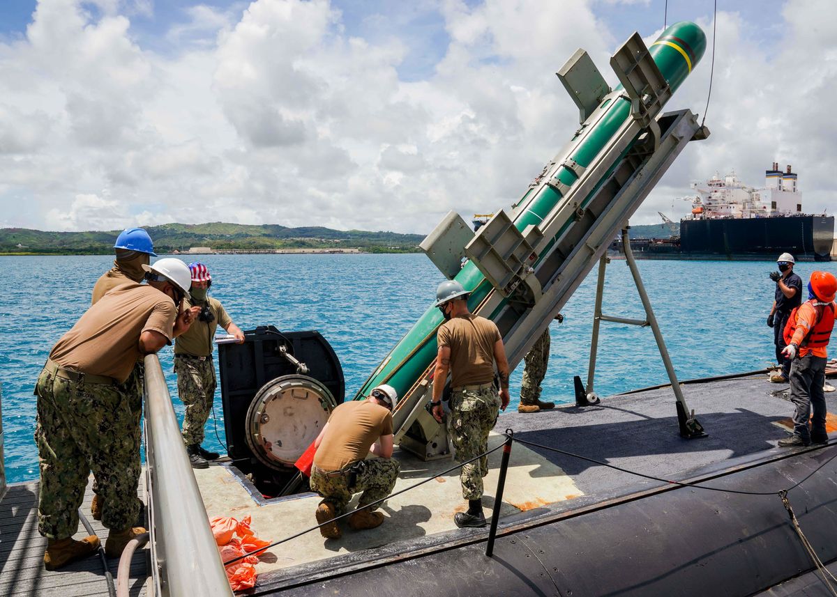 santa rita, guam aug 12, 2020 sailors assigned to the los angeles class fast attack submarine uss asheville ssn 758 lower an encapsulated harpoon loading shape into the boat during harpoon shipping, loading and handling certification training the certification is required in order for the submarine to carry and employ warshot tactical harpoons the harpoon system provides commanders with lethal all weather anti ship capability to rapidly engage targets at long ranges us navy photo by mass communication specialist 2nd class kelsey j hockenberger