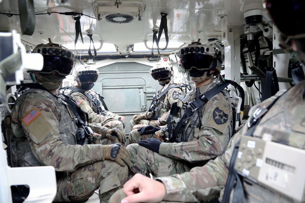soldiers don the integrated visual augmentation system capability set 3 hardware while mounted in a stryker in joint base lewis mccord, wa