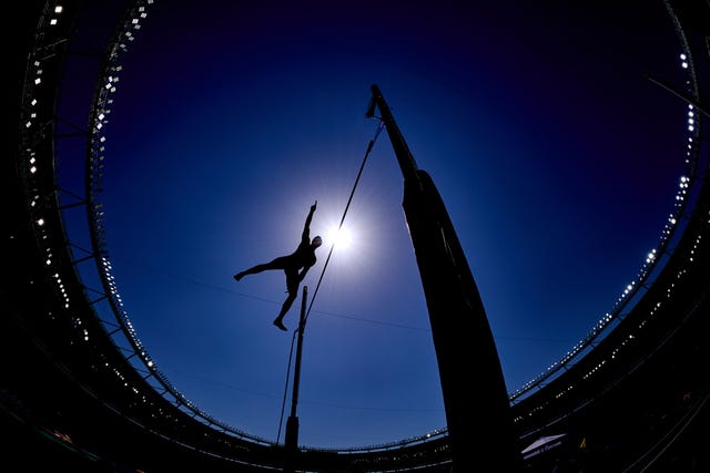 a person jumping over a bridge