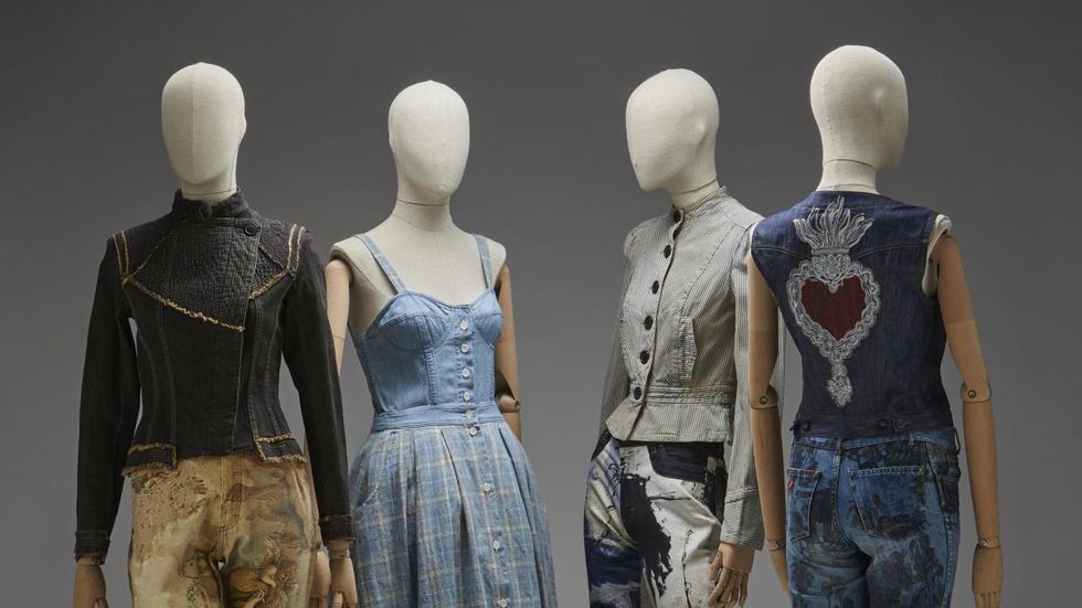 a group of mannequins wearing different outfits