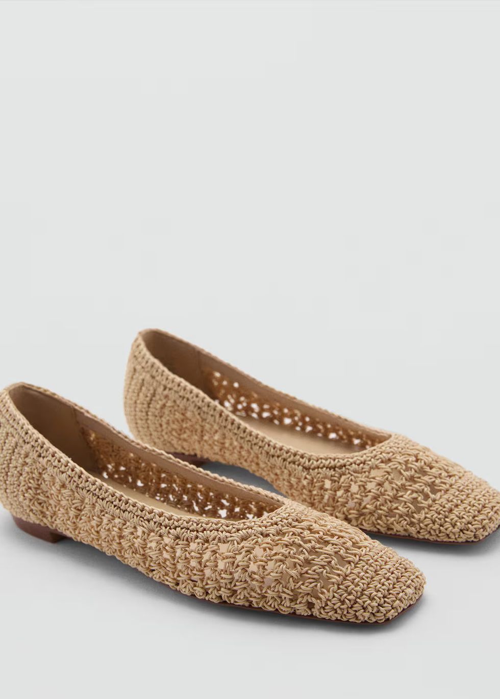 a pair of brown slippers