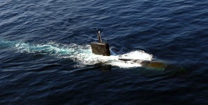 the los angeles class nuclear powered fast attack submarine uss miami ssn 755 surfaces in the north arabian sea during an anti submarine warfare exercise with the enterprise carrier strike group the three day, multi unit exercise is aimed at enhancing the strike group's asw capabilities uss miami is underway on a scheduled deployment as part of the kearsarge expeditionary strike group us navy photo by mass communication specialist 3rd class jhi l scott