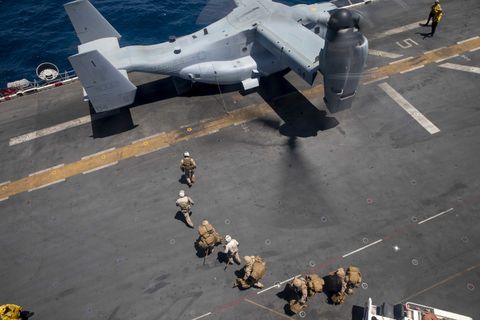 210729 n oj308 1056 arabian gulf july 29, 2021 marines assigned to the 24th marine expeditionary unit meu prepare to board n an mv 22 osprey, assigned to marine medium tiltrotor squadron vmm 162 reinforced, on the flight deck of the wasp class amphibious assault ship uss iwo jima lhd 7, july 29 iwo jima is deployed to the us 5th fleet area210729 n oj308 1056 arabian gulf july 29, 2021 – marines assigned to the 24th marine expeditionary unit board an mv 22 osprey tiltrotor aircraft assigned to marine medium tiltrotor squadron vmm 162 reinforced on the flight deck of amphibious assault ship uss iwo jima lhd 7 in the arabian gulf, july 29 iwo jima is deployed to the us 5th fleet area of operations in support of naval operations to ensure maritime stability and security in the central region, connecting the mediterranean and pacific through the western indian ocean and three strategic choke points us navy photo by mass communication specialist seaman isaac a rodriguez of operations in support of naval operations to ensure maritime stability and security in the central region, connecting the mediterranean and pacific through the western indian ocean and three strategic choke points us navy photo by mass communication specialist seaman isaac a rodriguez