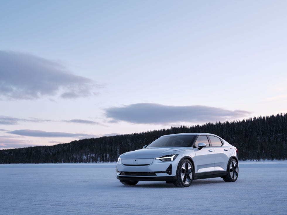 white car parked on a snowy road