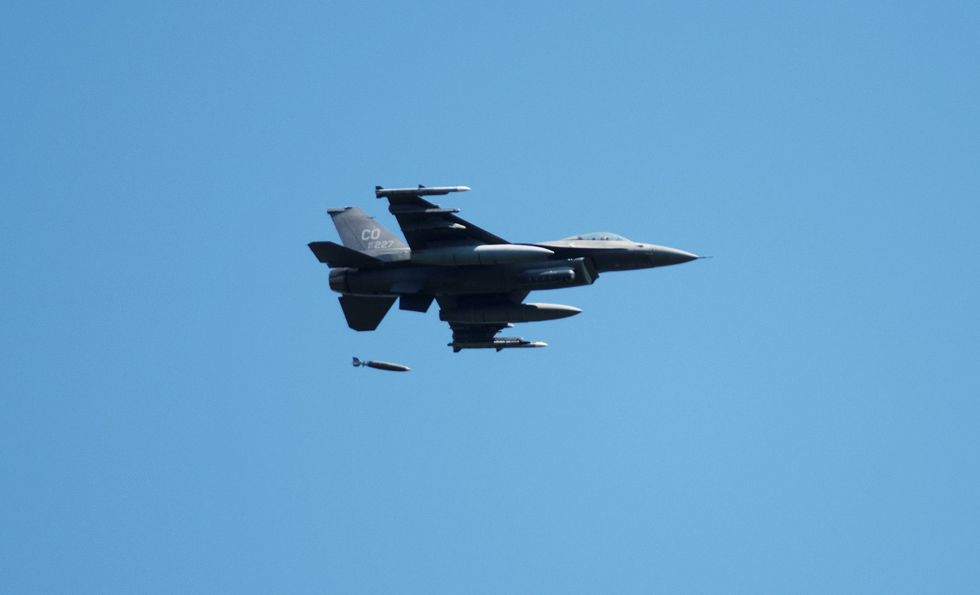 an air force f 16 fighting falcon flies over fort mccoy, wis, on aug 13, 2021 the fighter jet was participating in the northern lightning 2021 exercise at nearby volk field, wis f 16s also dropped 500 pound joint direct attack munitions for the first time at the fort mccoy impact area during the exercise volk field combat readiness training center hosted approximately 50 aircraft and nearly 1,000 members of the national guard, air force, army, and navy as part of the training exercise air force aircraft also regularly fly over fort mccoy for training operations photo by kevin clark, fort mccoy multimediavisual information office