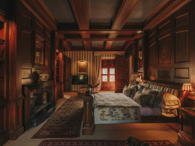 Luxurious wooden bedroom with elegant furnishings.
