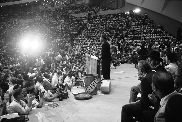 Martin Luther King Jr addresses a large crowd at the culmination of the Walk To Freedom march held to promote racial equality, at Cobo Hall, Detroit, Michigan