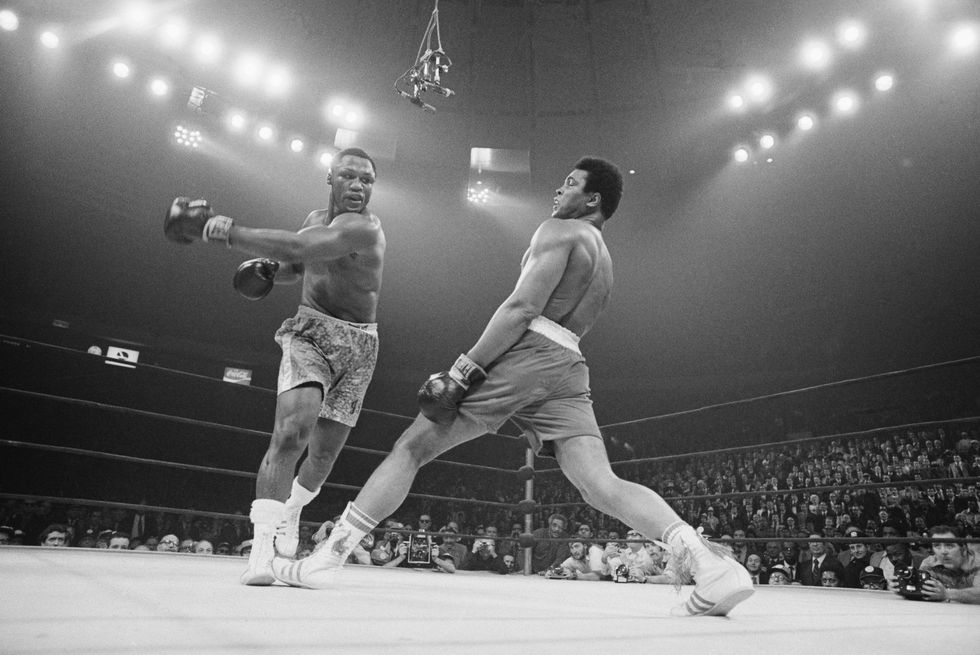 Muhammad Ali steps away from a punch thrown by boxer Joe Frazier during their heavyweight title fight at Madison Square Garden in 1971. Frazier became the undisputed heavyweight champ of the world by winning a unanimous 15-round decision
