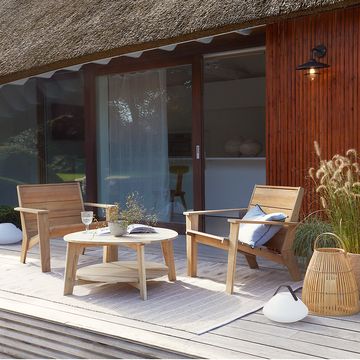 a patio with a table and chairs