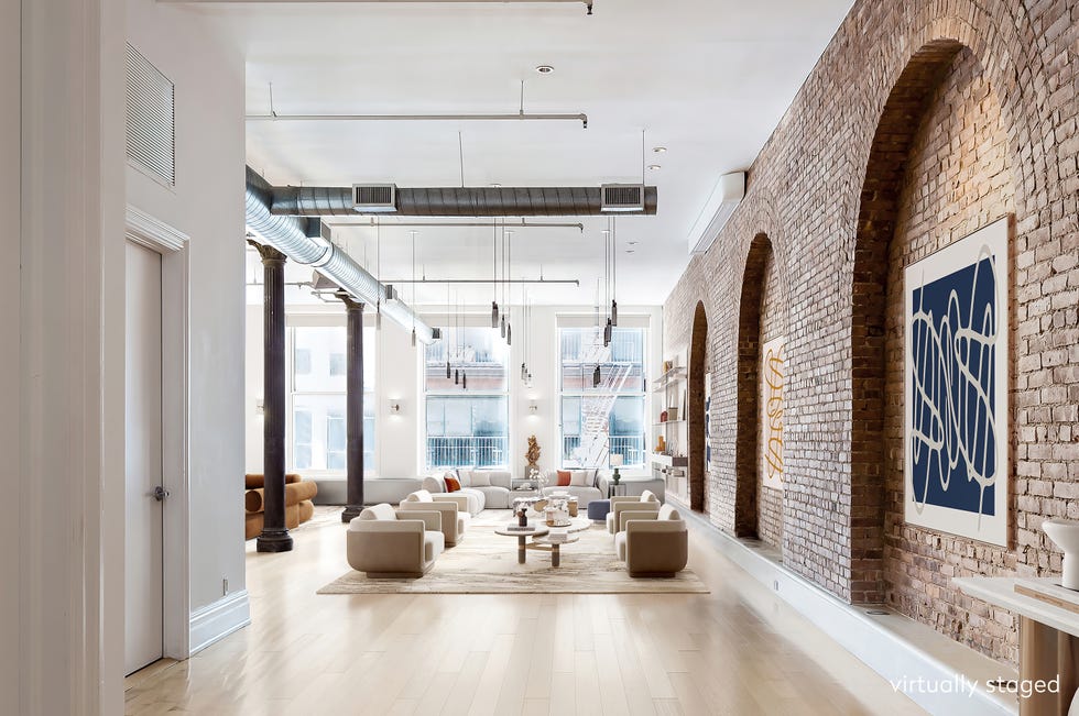 Modern living space featuring a blend of brick and contemporary design elements.