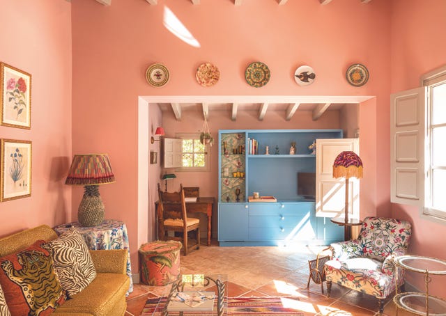 Cozy living room with colorful furnishings and decor.