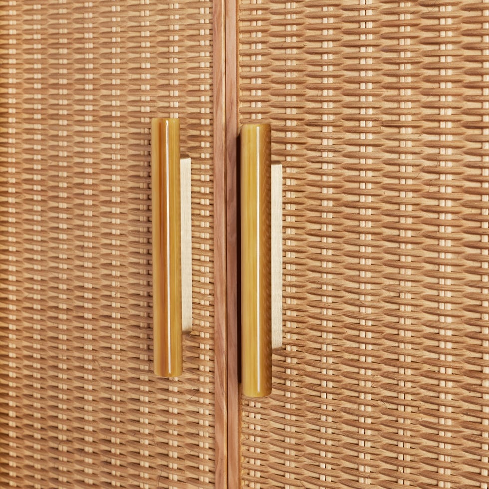 Cabinet doors with woven texture and unique handles.