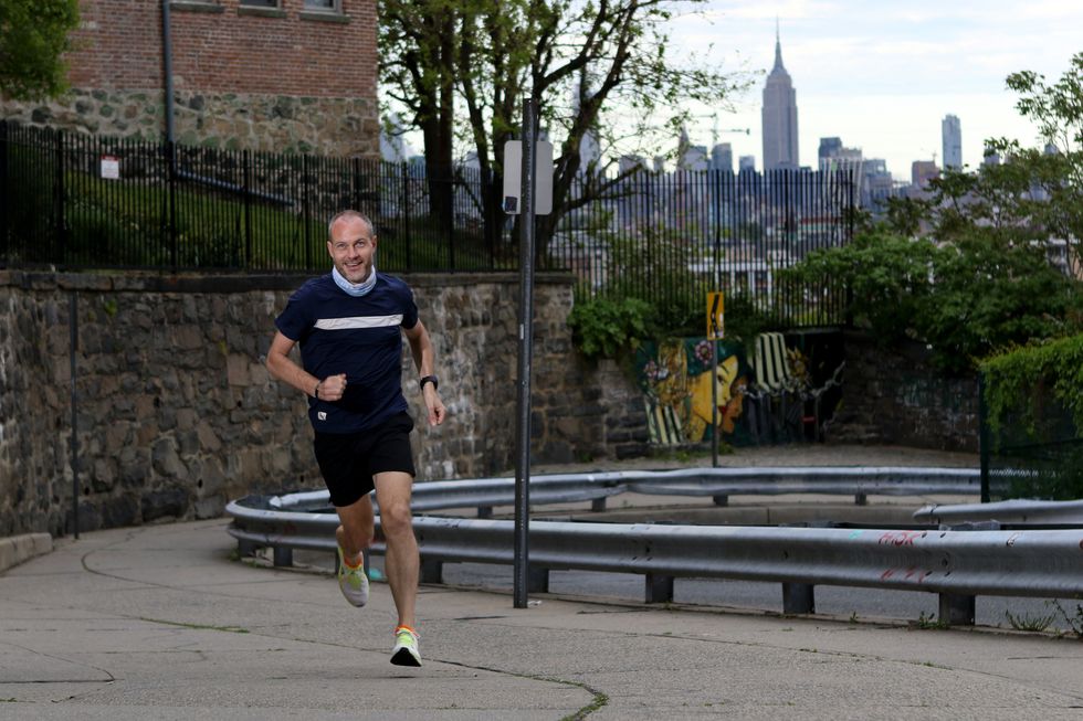 jeff dengate on mountain rd in jersey city, with the empire state building in the background
