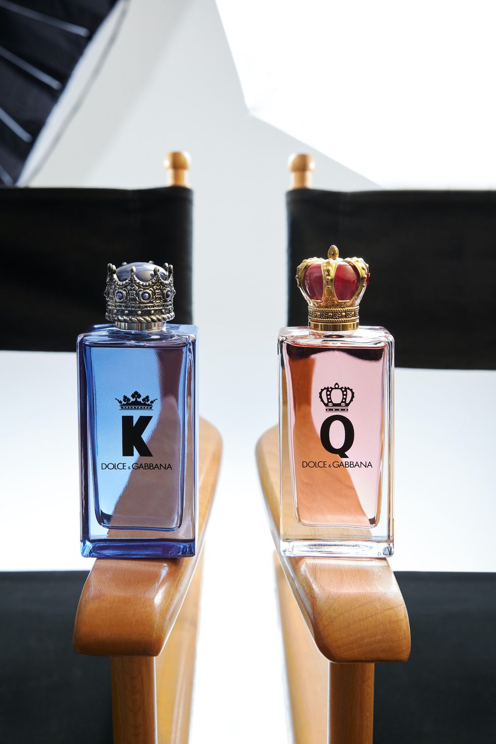 bottles of k and q fragrance on directors chairs