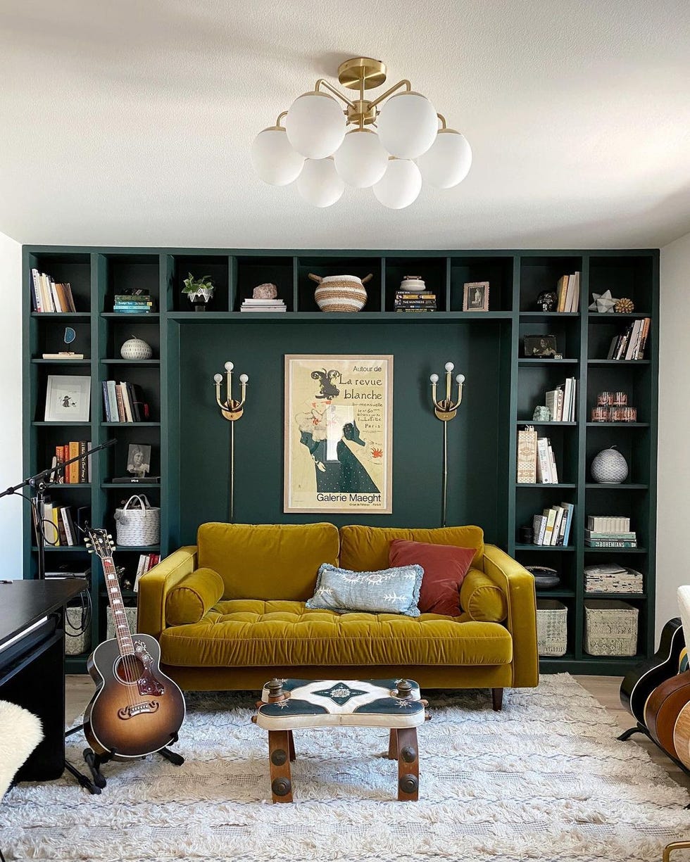 Room with sofa and shelves with books