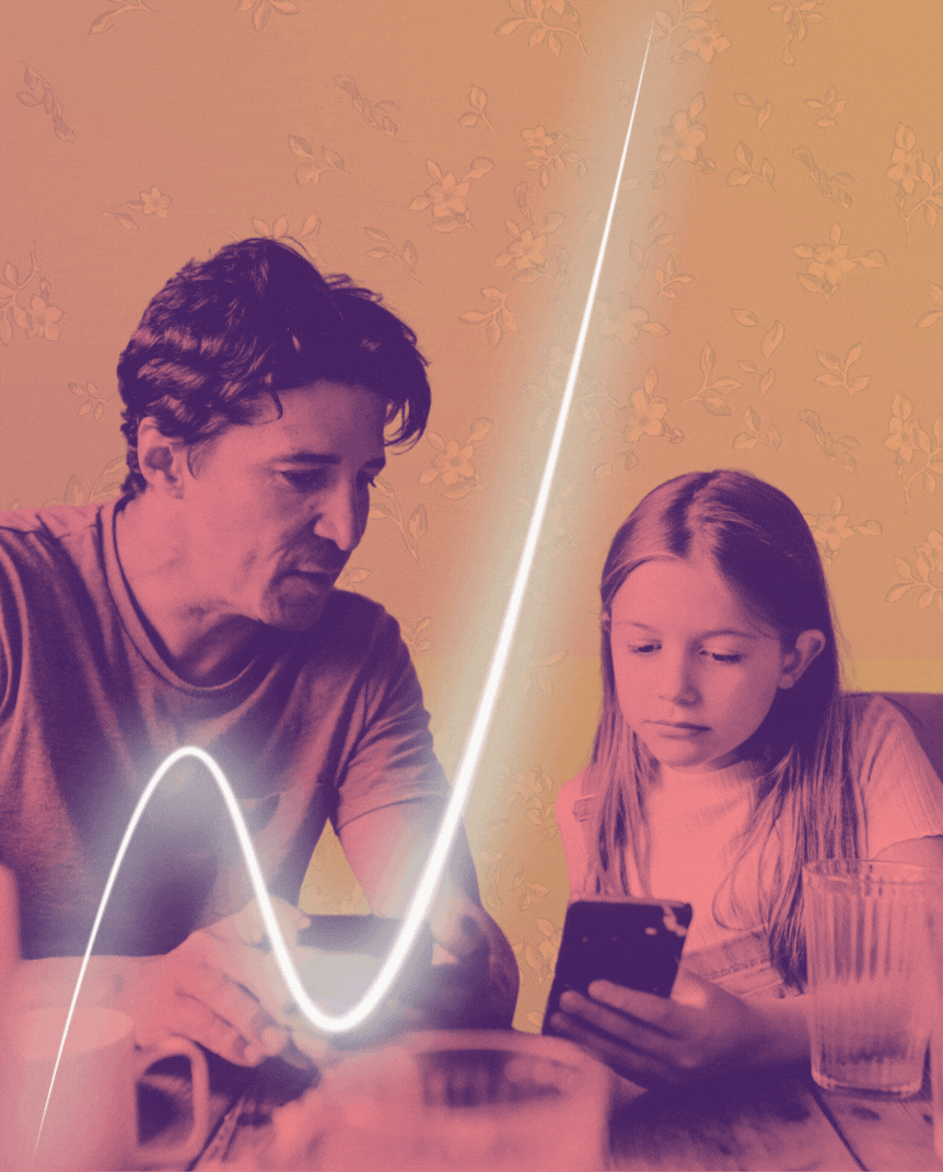 dad and daughter looking at phone