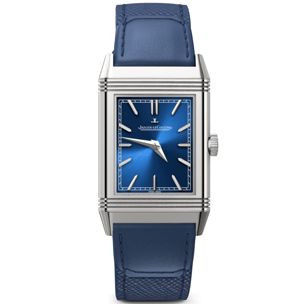 luxury watch with a blue face and leather strap