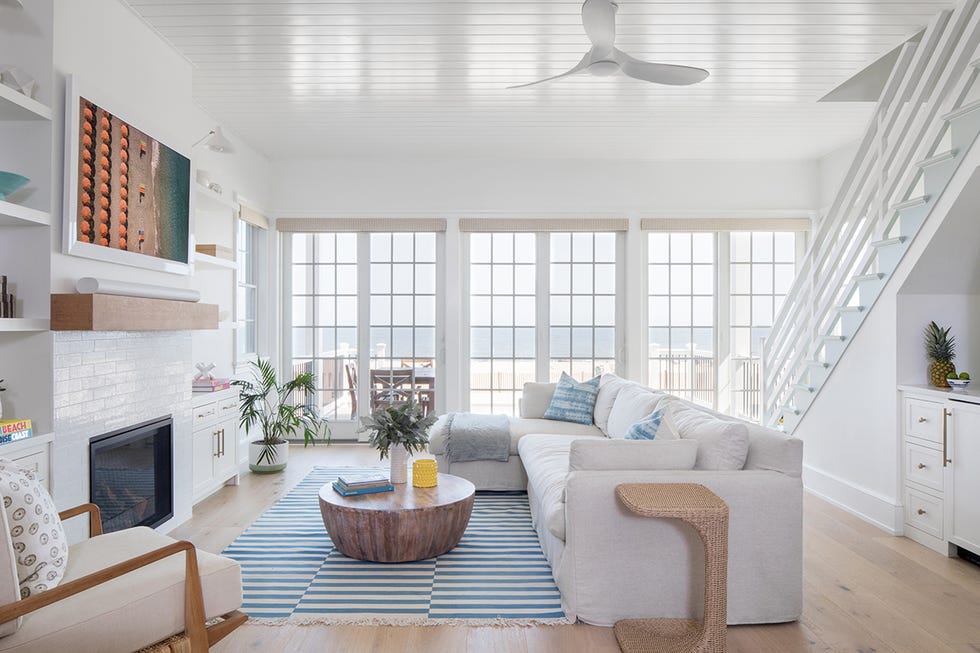 White living room with fireplace and white sofa