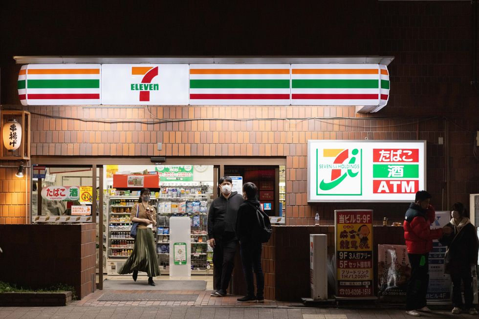 tokyo, japan 20211104 people seen at the 7 eleven convenience store in shimbashi district photo by stanislavsopa imageslightrocket via getty images