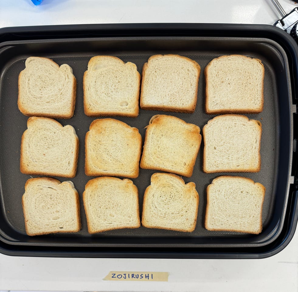 a griddle with twelve slices of toasted bread
