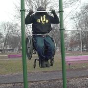 man in wheelchair does 15 pullups