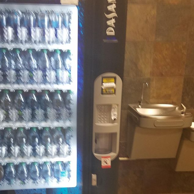 Vending Machine Next To Water Fountain