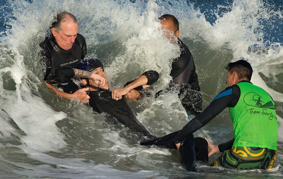 Black Mountain man fighting to walk again following rare spinal cord injury  while surfing