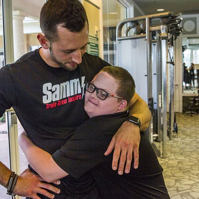 teen with down syndrome is best friends with trainer
