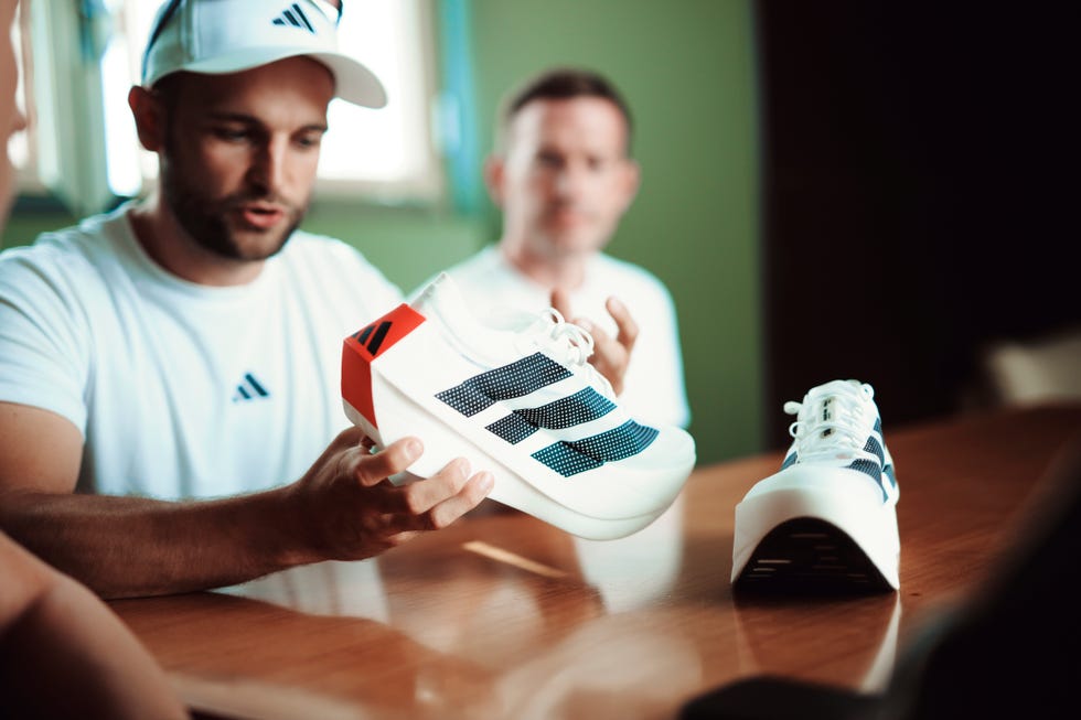 man holding shoe