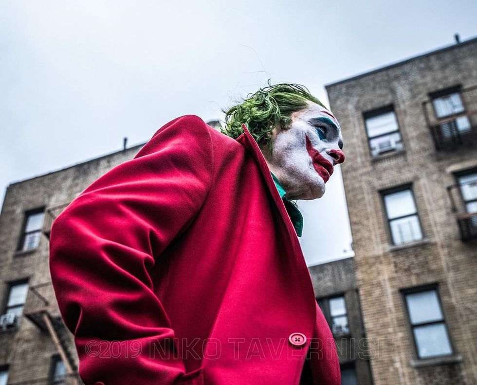 Red, Supervillain, Joker, Fictional character, Outerwear, Costume, Clown, Smile, Carnival, 