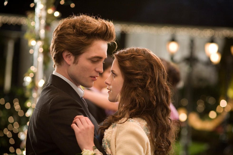 couple dancing at a romantic setting adorned with lights
