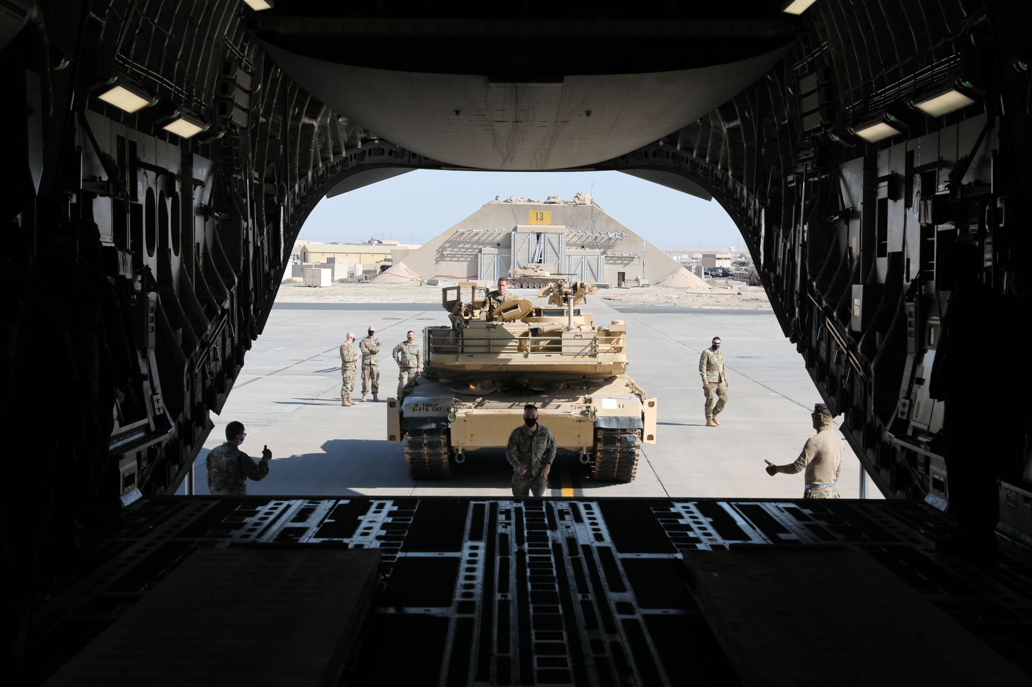 a us army m1a2 sepv2 abrams tank assigned to 1st battalion, 163rd cavalry regiment, task force griz, is loaded onto the cargo ramp of a us air force c 17 globemaster iii assigned to the 816th expeditionary airlift squadron, during a training event at ali al salem air base, kuwait, jan 19, 2022 the partnership of the two services was to train and demonstrate the movement capabilities of us air force and us army operations in the us central command area of responsibility us army photo by spc william china