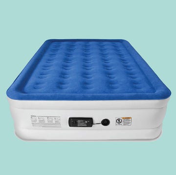 a blue and white air mattress on a turquoise background