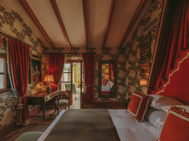 A luxurious bedroom featuring vibrant decor and an inviting atmosphere.