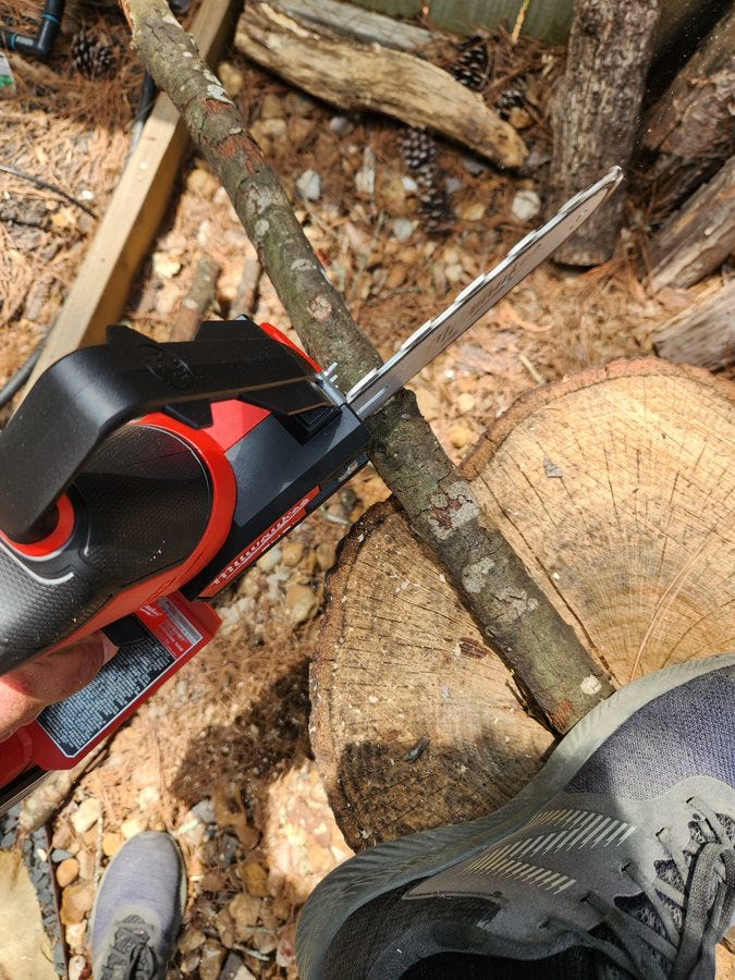 a mini chainsaw in field tests