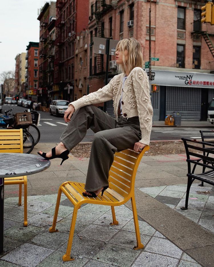 Sitting, Furniture, Street fashion, Fashion, Yellow, Urban area, Snapshot, Street, Photography, Leg, 