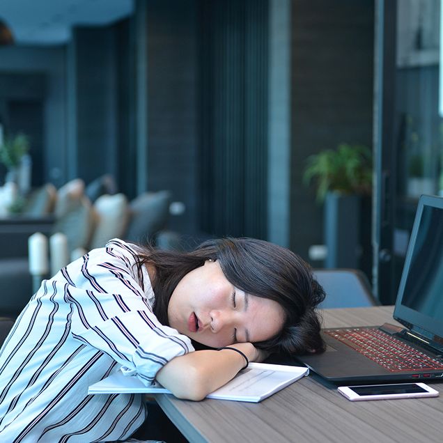 woman napping office desk