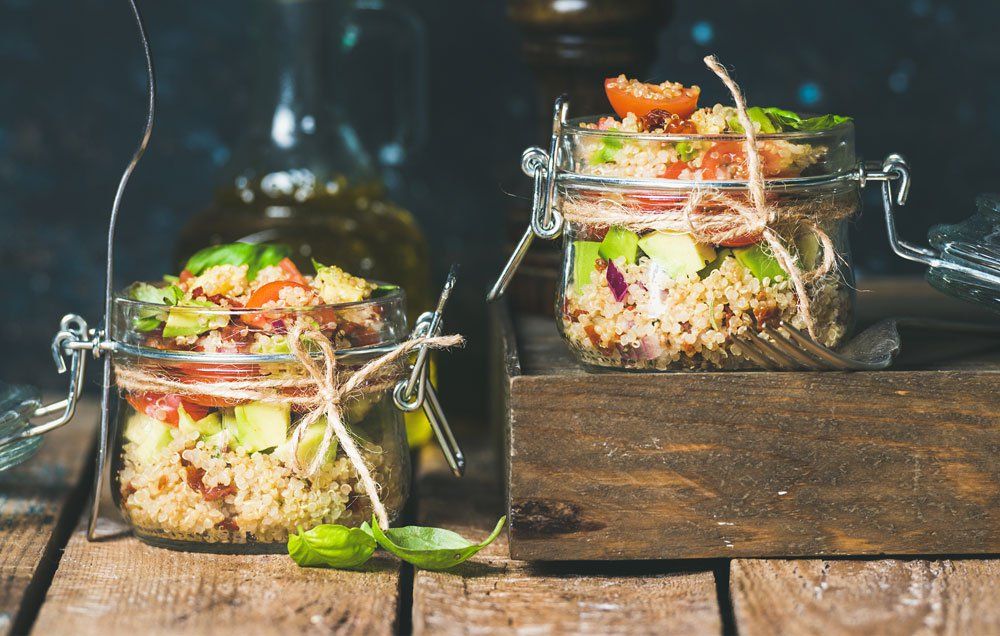 meal prep glass containers with quinoa salad