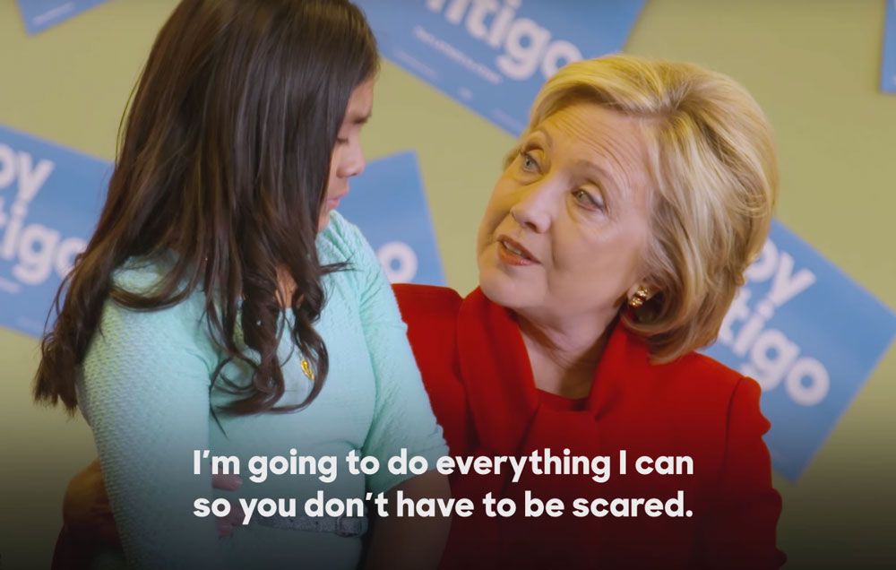 Hillary comforting little girl.