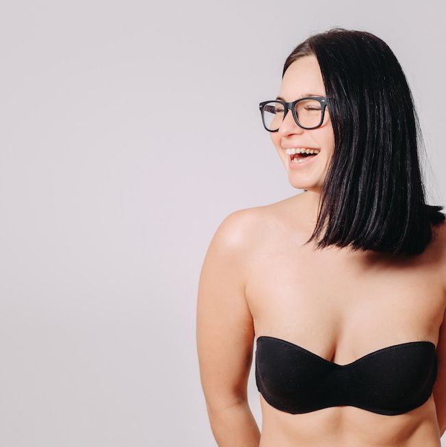 Beautiful slim body of woman in studio. Big natural woman boobs