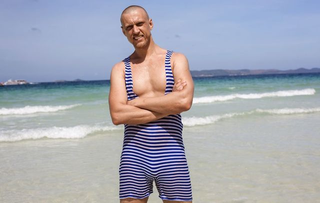 hot muscular man in wet underwear at the beach