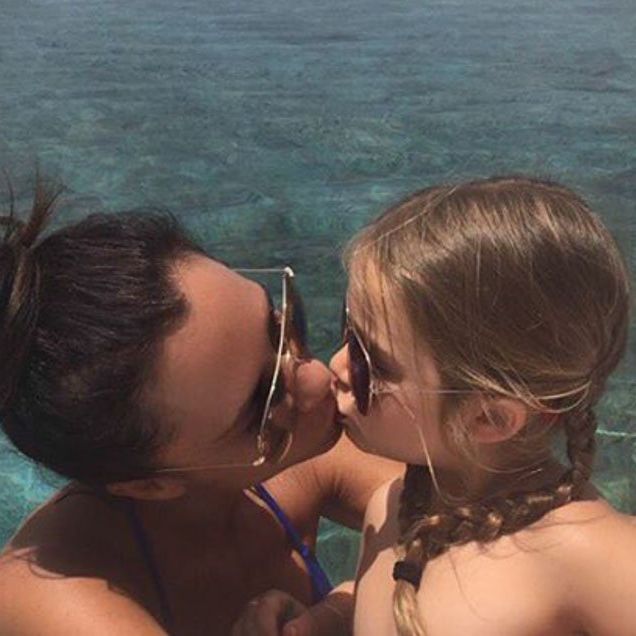 Victoria Beckham kissing her daughter