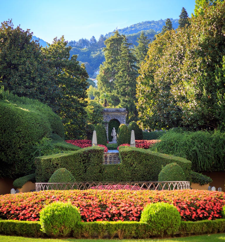 Formal garden featuring manicured hedges and colorful flowers