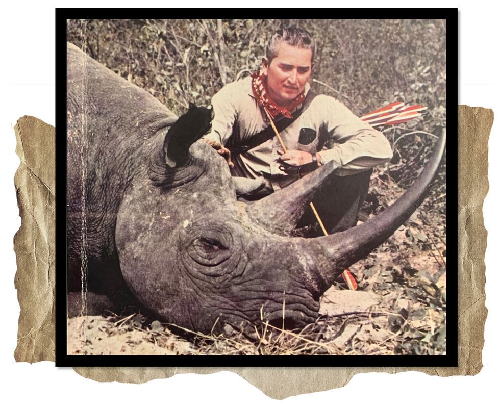 bob swinehart with the rhinoceros he shot with his bow and arrow