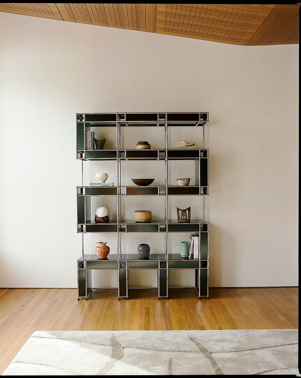 a green and silver metal bookcase