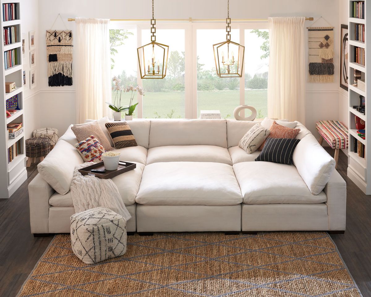 Furniture, Living room, Room, Couch, Interior design, Floor, Property, Wood flooring, Product, Laminate flooring, 