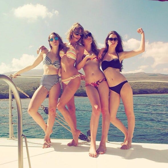 a group of women posing for a photo on a boat