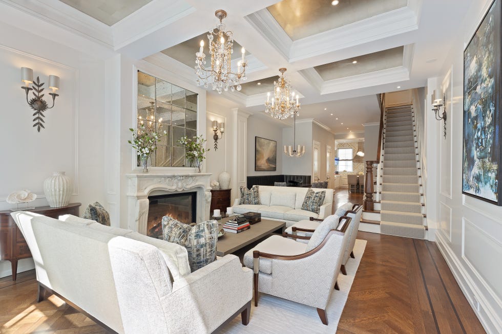 Cozy living room with elegant furnishings and stairway