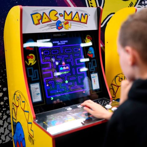 a boy plays the pacman retro game at the video games trade fair gamescom in cologne, western germany, on august 21, 2019 photo by ina fassbender  afp        photo credit should read ina fassbenderafp via getty images