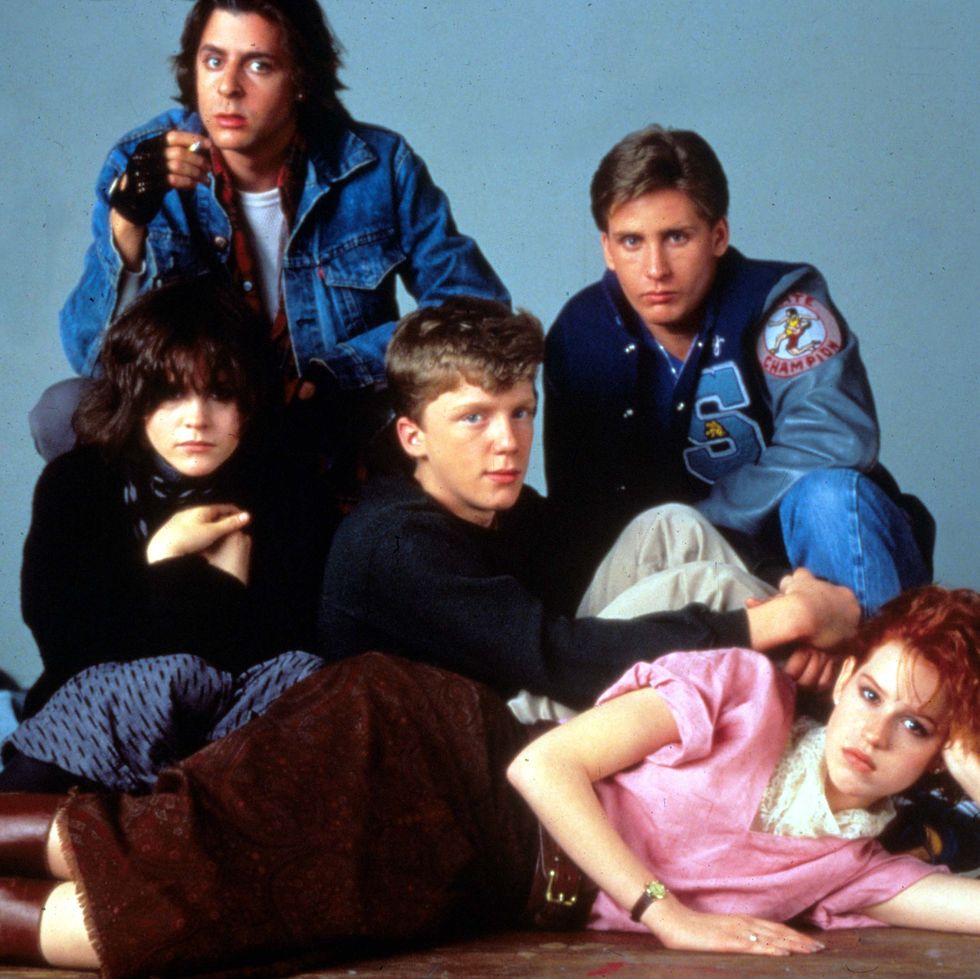 The cast of The Breakfast Club posing together wearing typically 80s fashion outfits